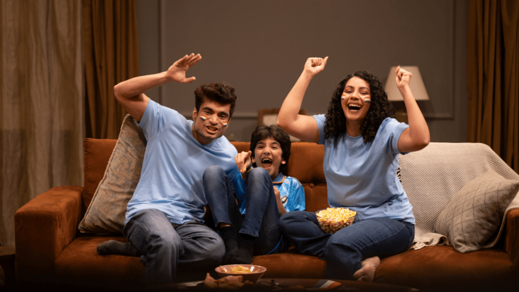 three people watching a movie