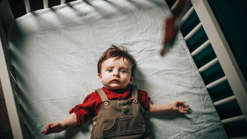 A baby in a crib