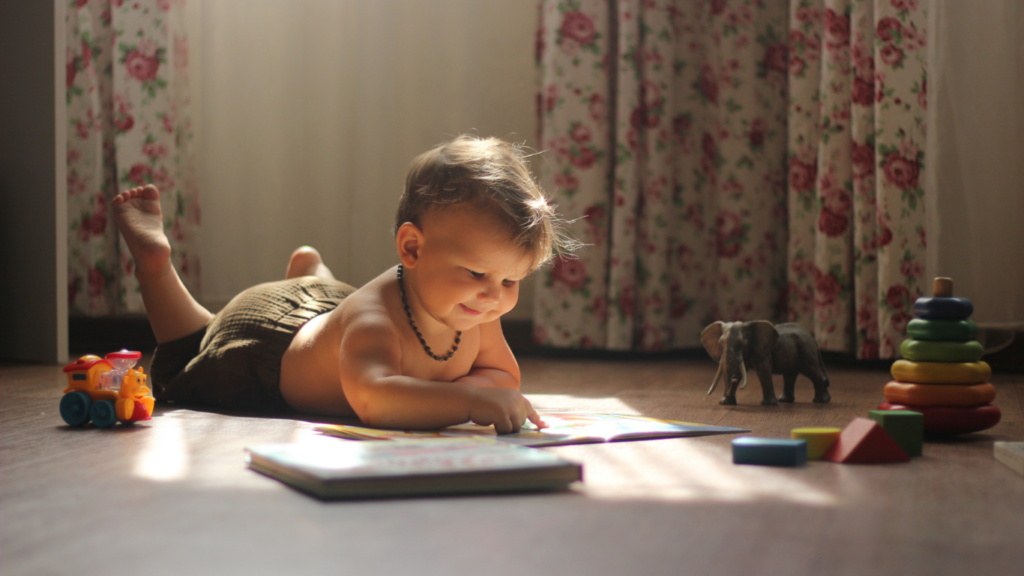 A baby is playing with toys on the floor