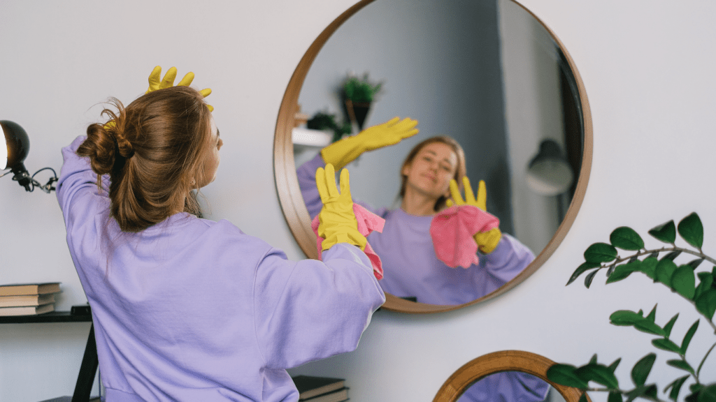 a person cleaning a glass