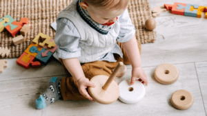 A child playing with wooden blocks
