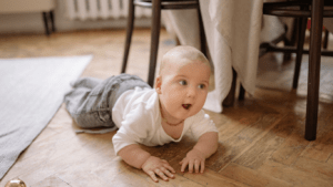a baby crawling on the floor
