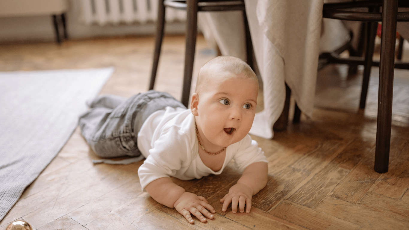 a baby crawling on the floor