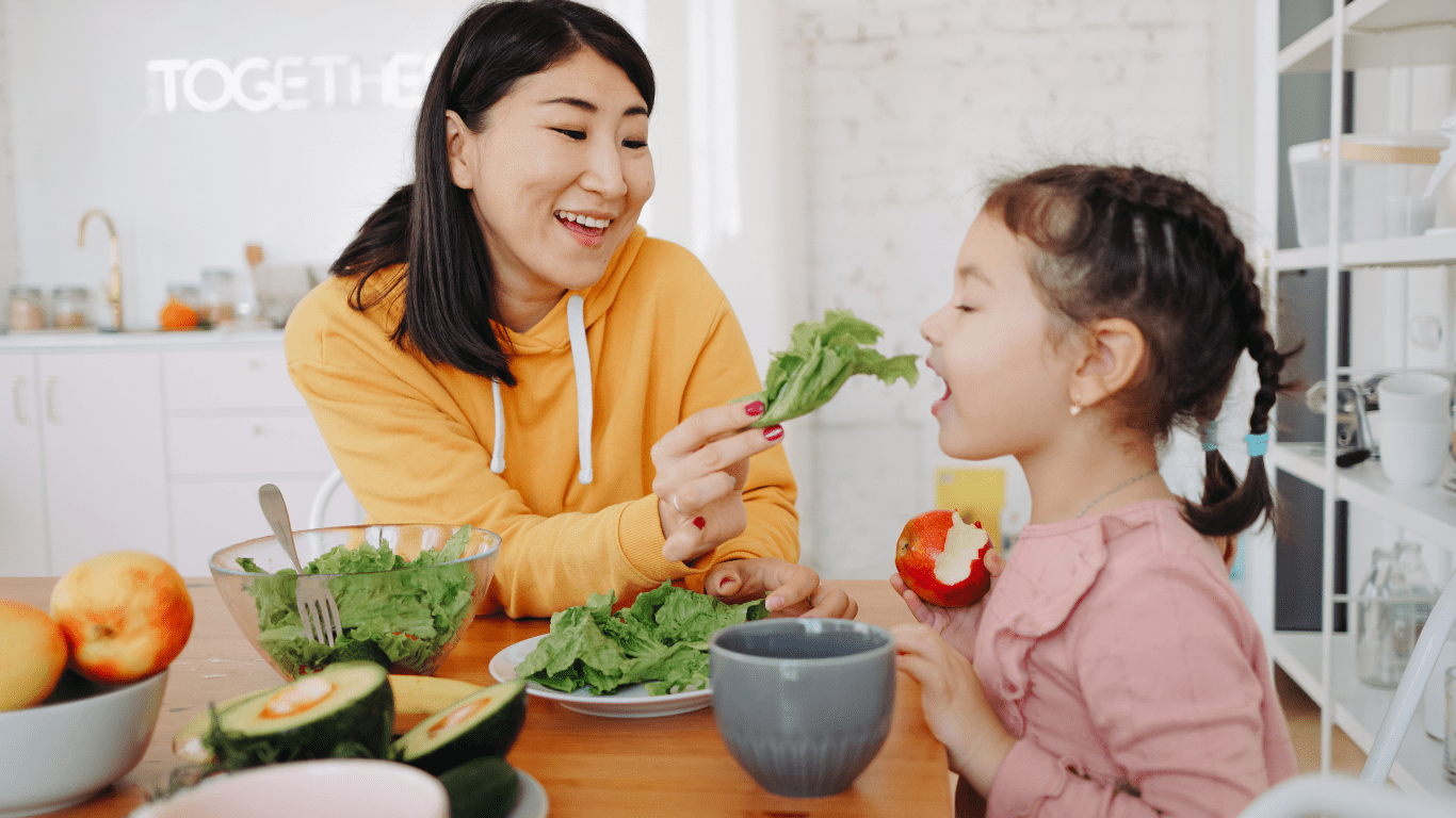 mother and daughter eating healthy food