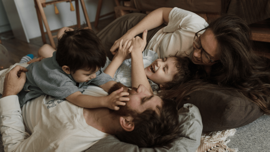 family lying in the bed together