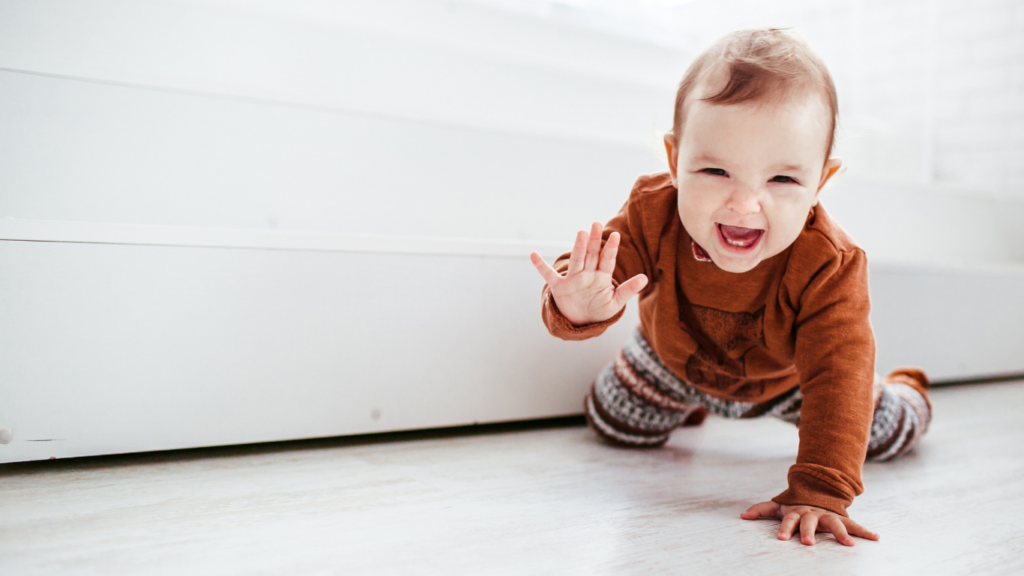 a baby crawling on the floor