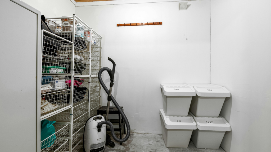 a room with shelves filled with various items