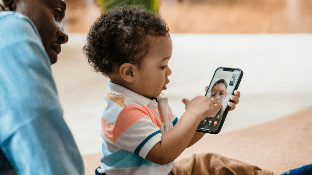 baby holding a phone