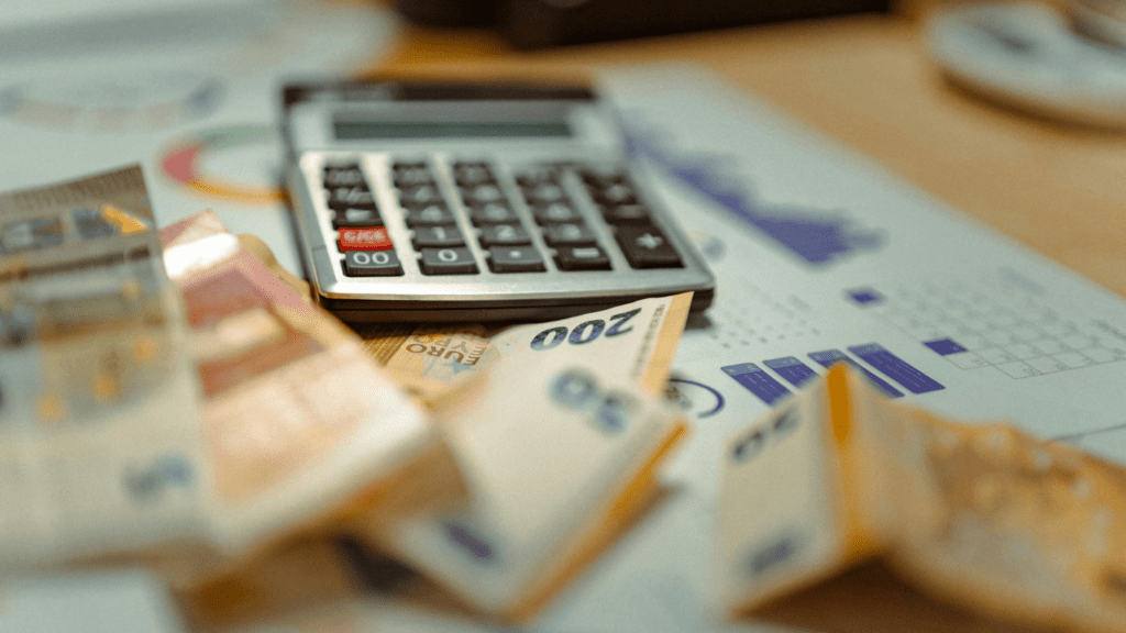 calculator and money on a desk