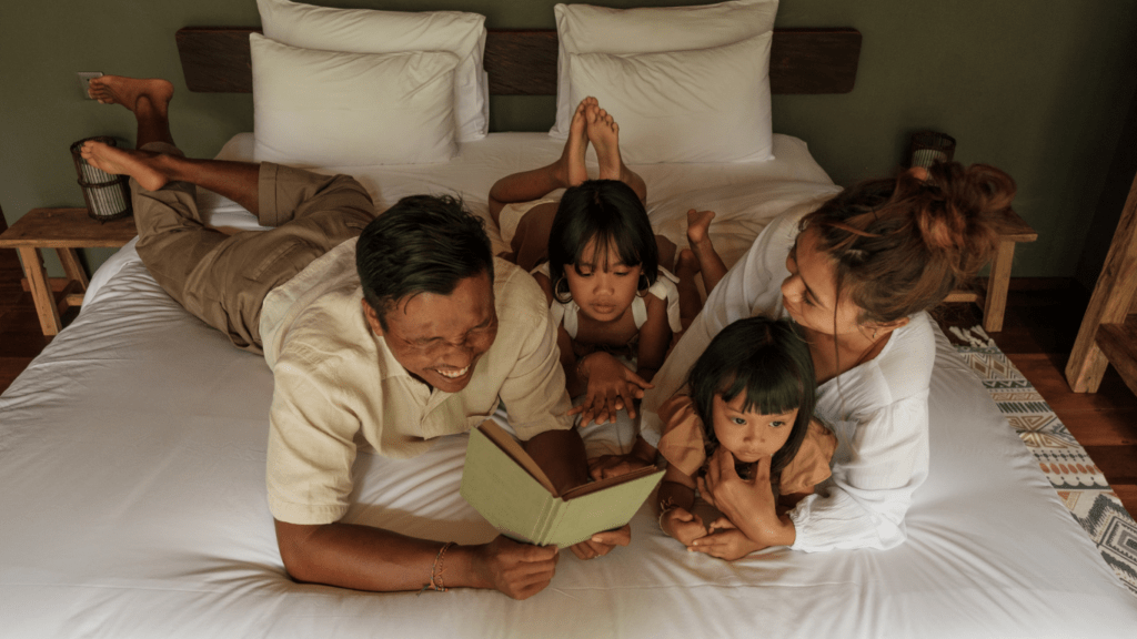 family lying in the bed together