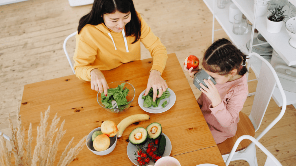mother and daughter eating healthy food